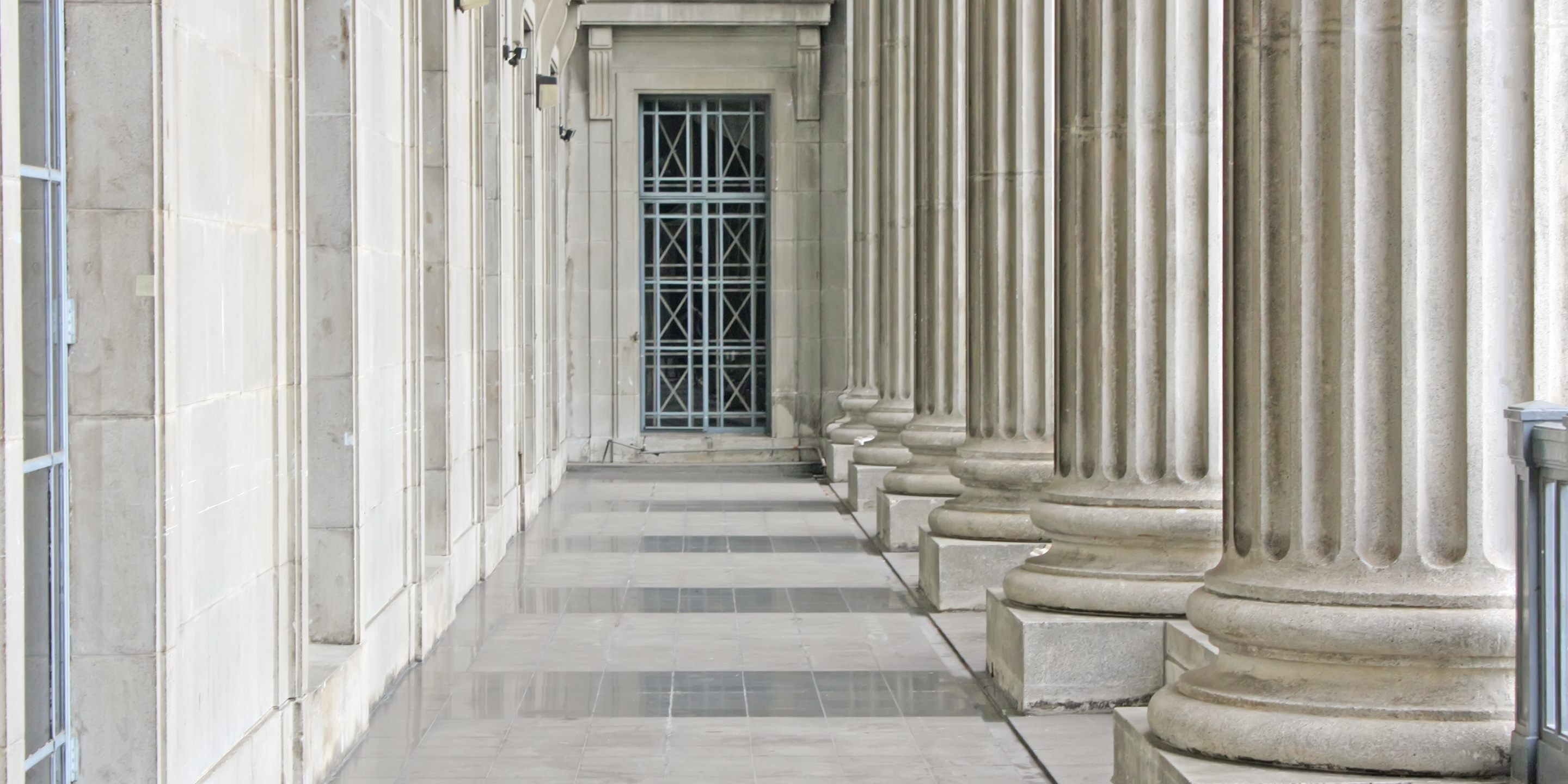 Stone columns along the colonnade of a government building